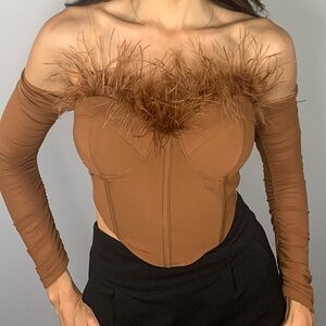 Bustier top with attached mesh sleeves and feathers on cups